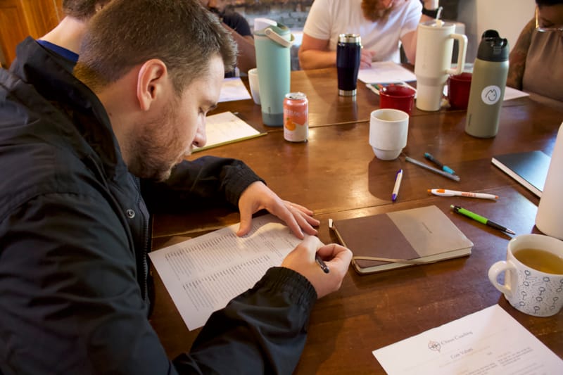 A participant working through the core values exercise at the Fraser retreat